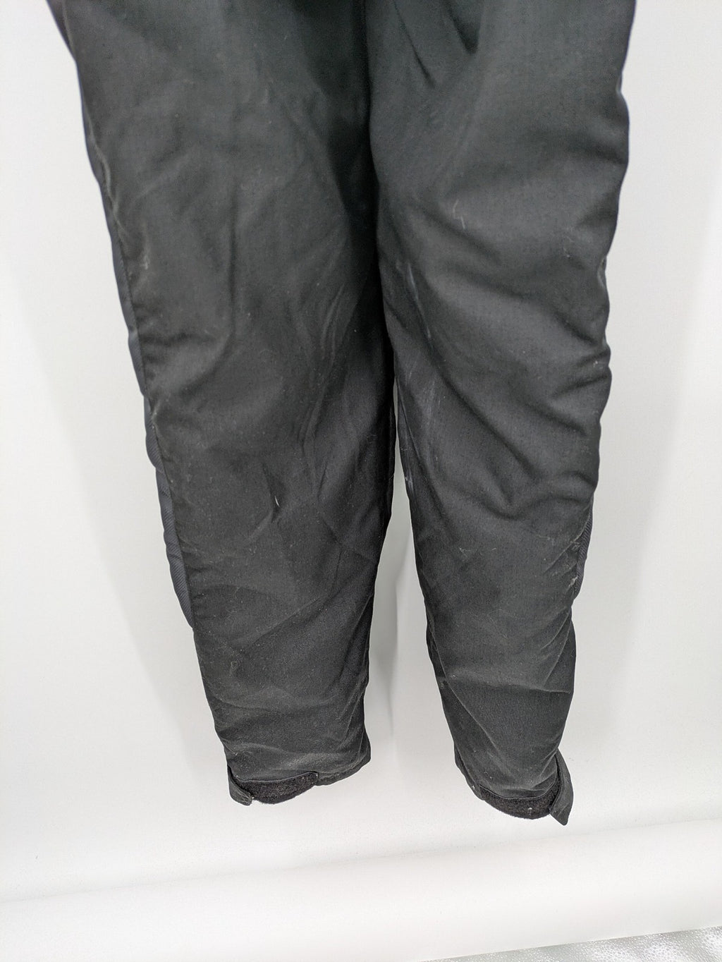 Hein Gericke black chaps with adjustable suspenders, made from durable Cordura and Kevlar.