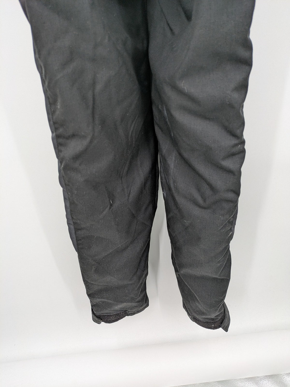 Hein Gericke black chaps with adjustable suspenders, made from durable Cordura and Kevlar.