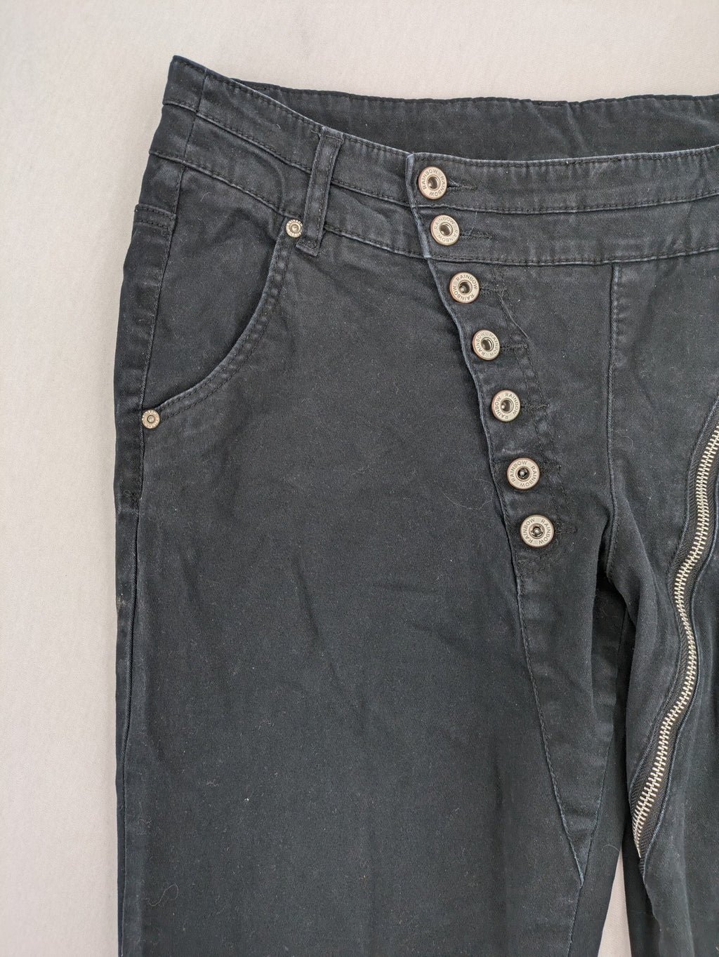 REI grey pants asymmetrical design with diagonal zipper and button placket, cotton blend.