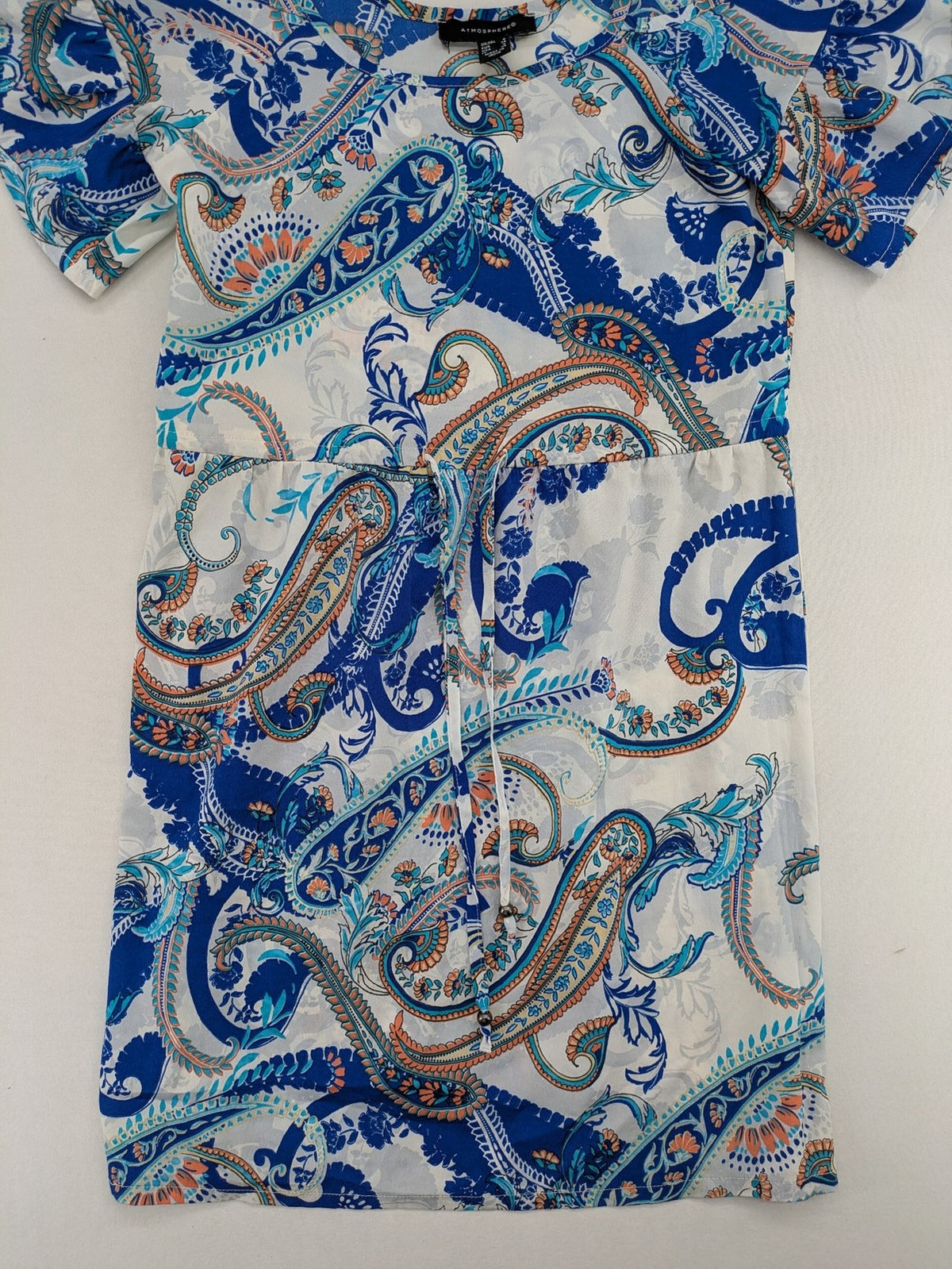 Atmosphere orange summer dress with colorful paisley pattern and cold shoulder design.