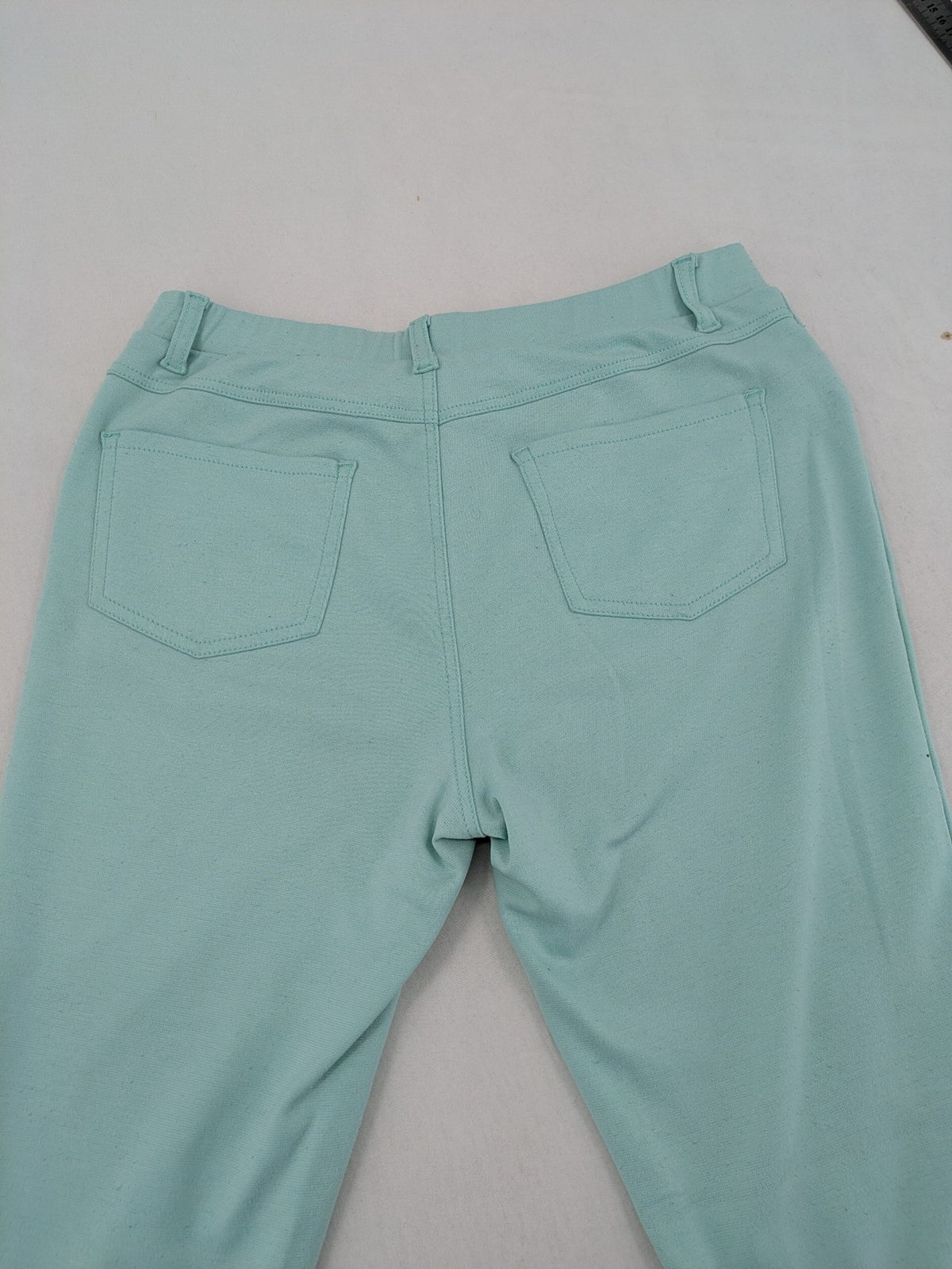 Dito green treggings with pull-on design, front pockets, and belt loops.