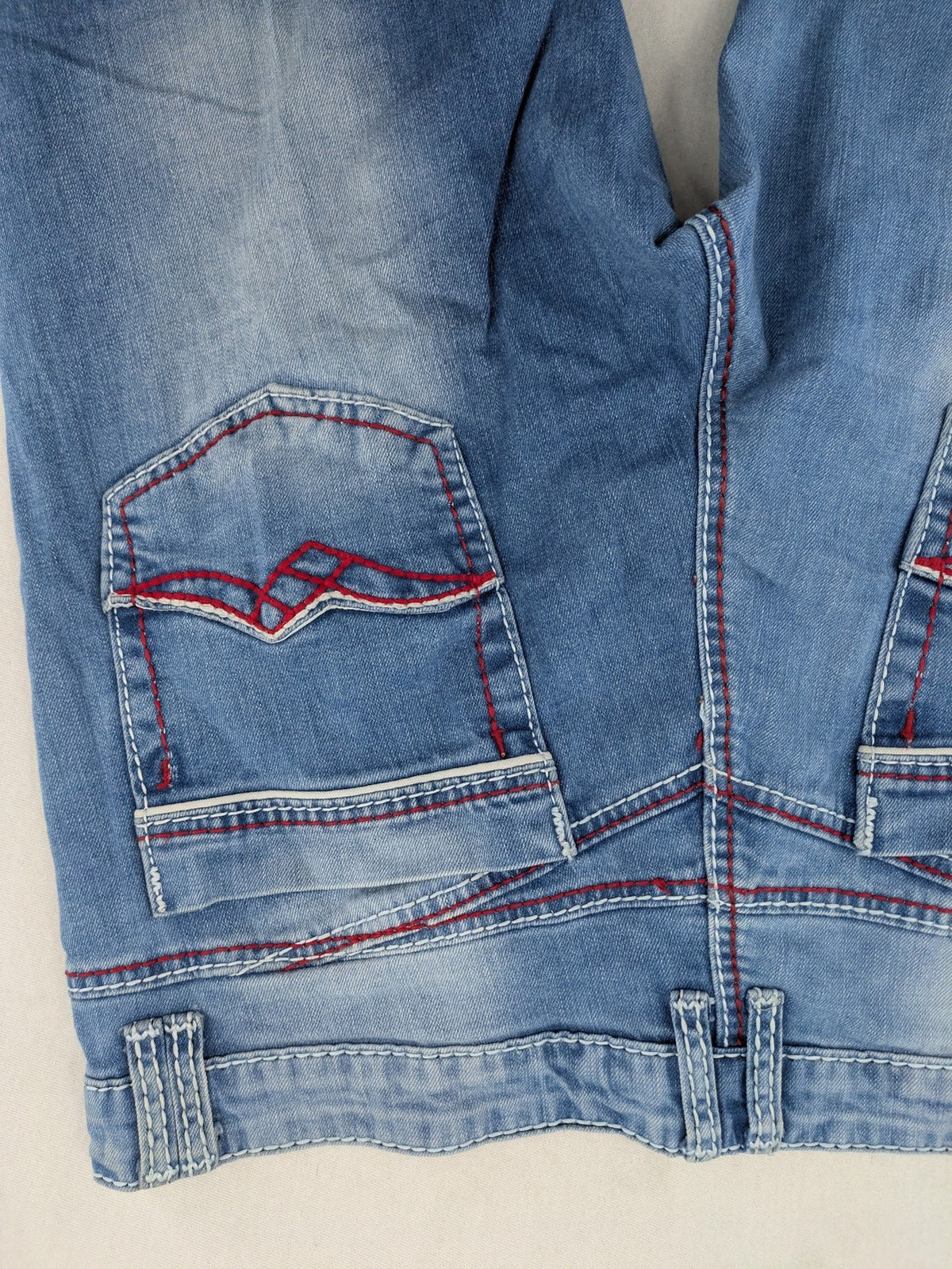 R-Neal blue straight jeans with red-white contrast stitching and classic 5-pocket design.