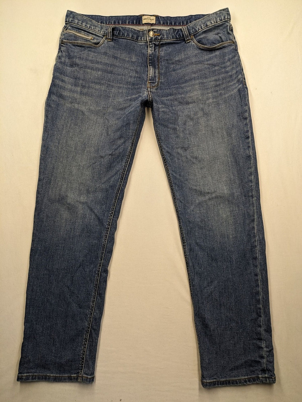 Montego blue straight jeans with stretch denim, classic design, and regular fit.