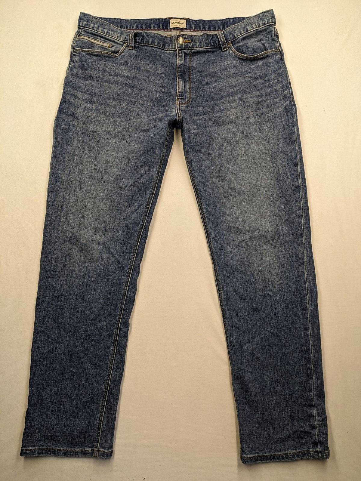 Montego blue straight jeans with stretch denim, classic design, and regular fit.