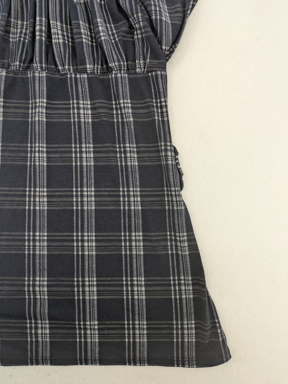 Eleganz navy and white checked top with square neckline and gathered bust detail.