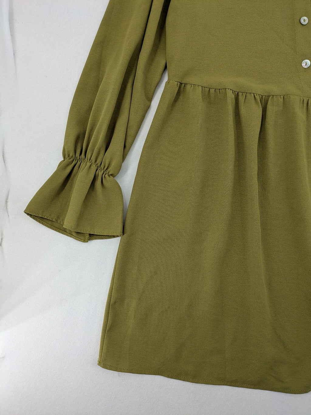 Buqre Store khaki A-line dress with puff sleeves, ruffled cuffs, and button placket.