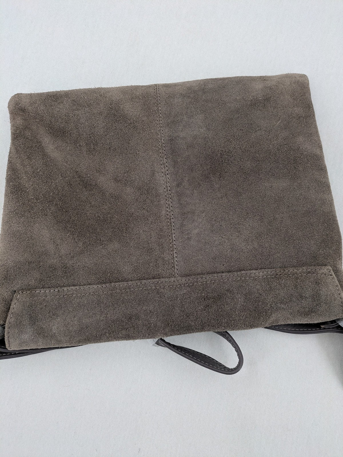 CNTMP grey suede crossbody handbag with flap and silver twist lock closure.