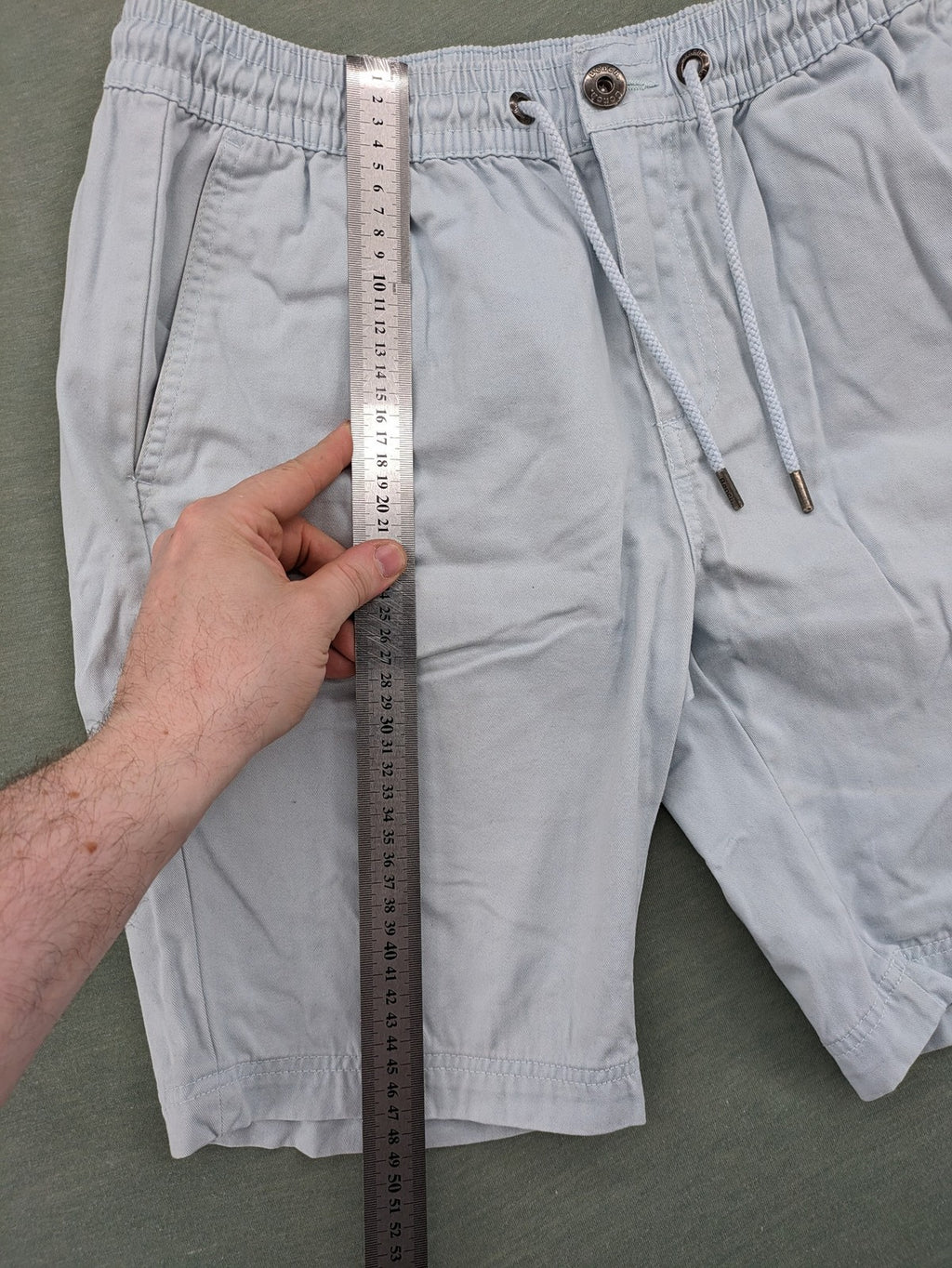 Bench blue shorts with elastic waistband, drawstring, and multiple pockets.