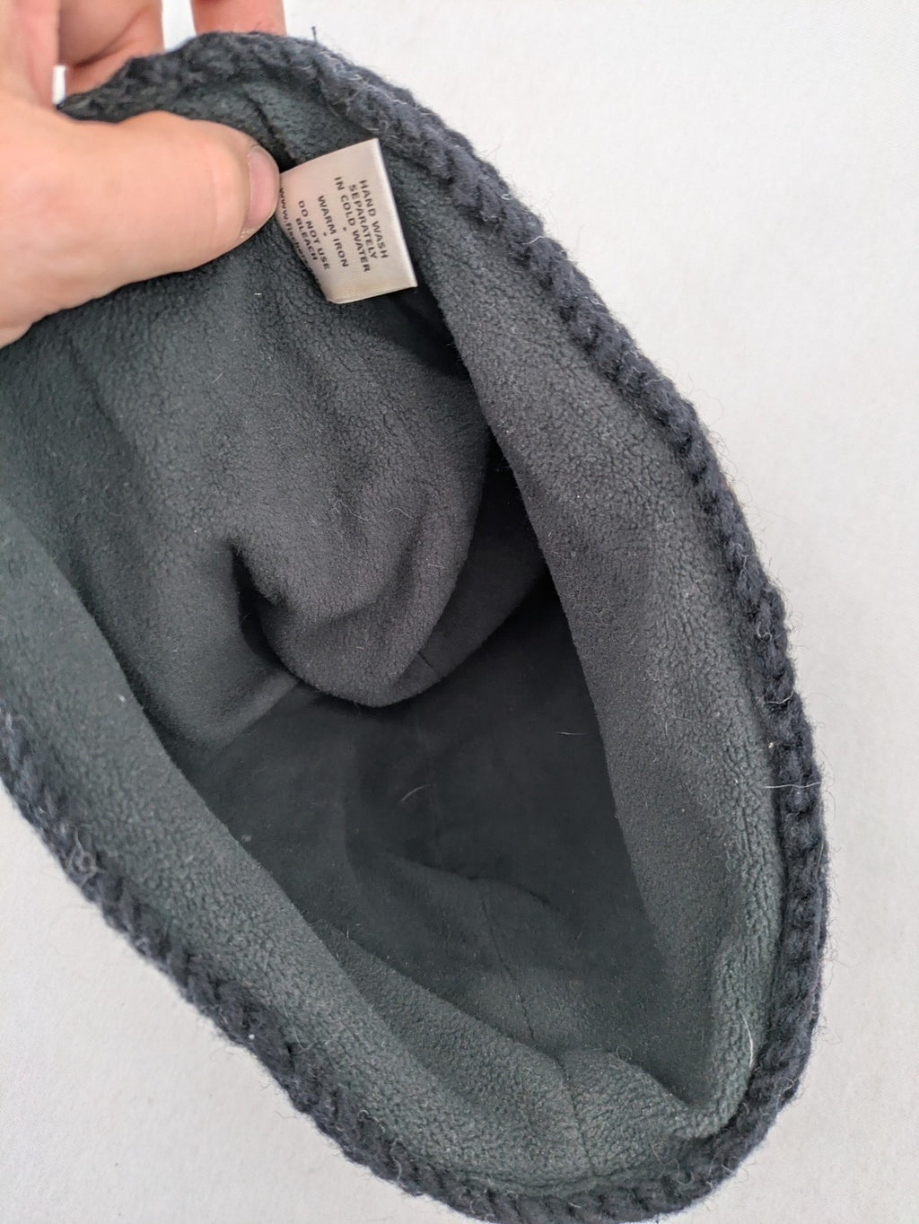Fischers Textil multi beanie hand-knitted wool with fleece lining and floral appliqué.