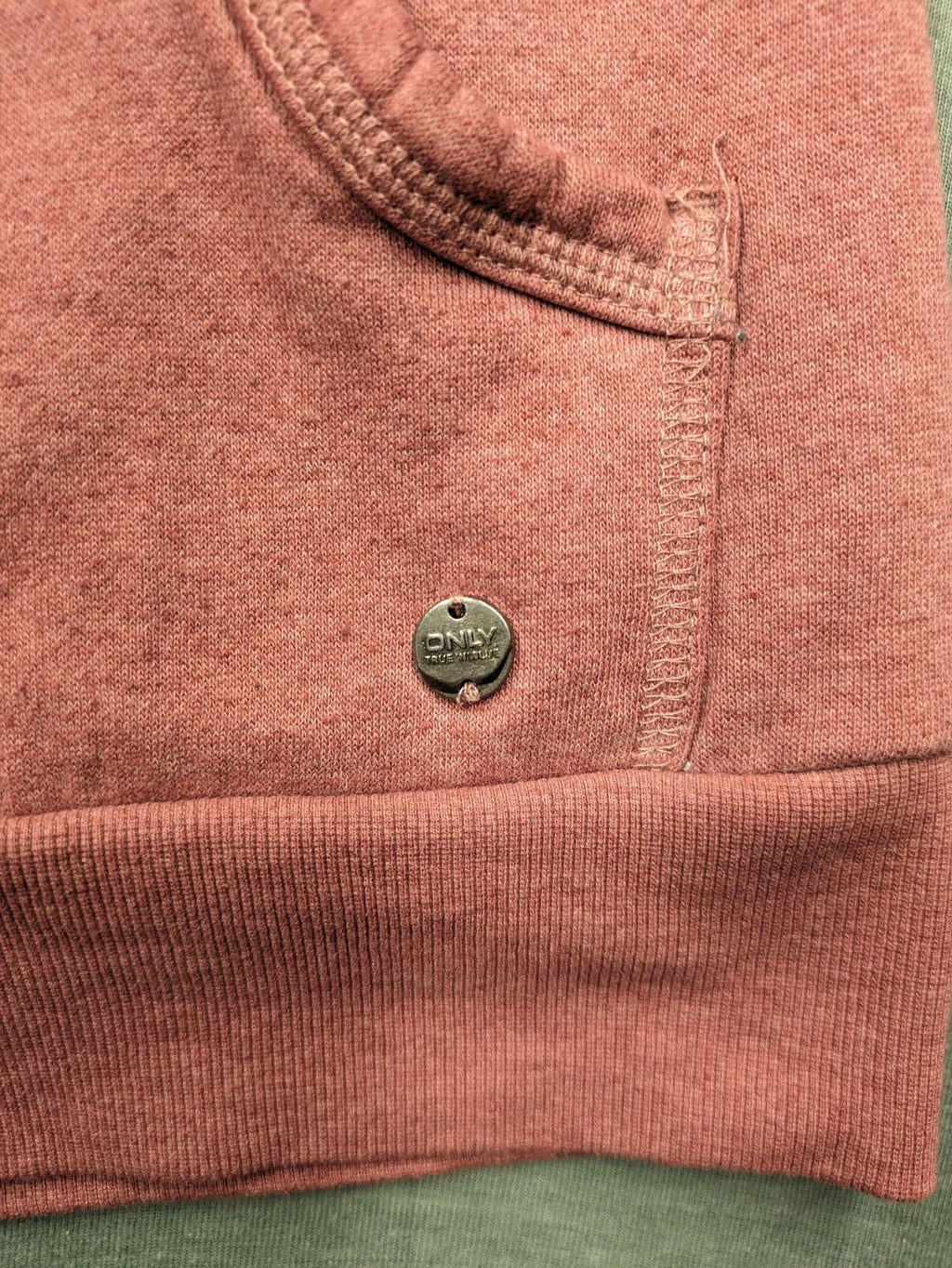 ONLY pink zip-through hoodie with hood, front zipper, and two pockets.