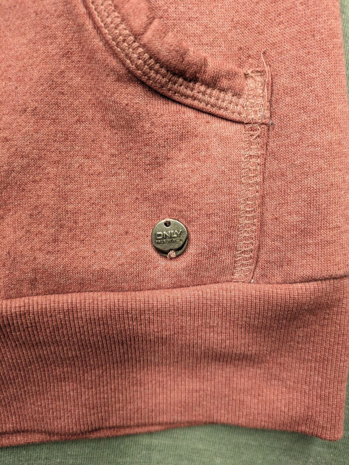 ONLY pink zip-through hoodie with hood, front zipper, and two pockets.