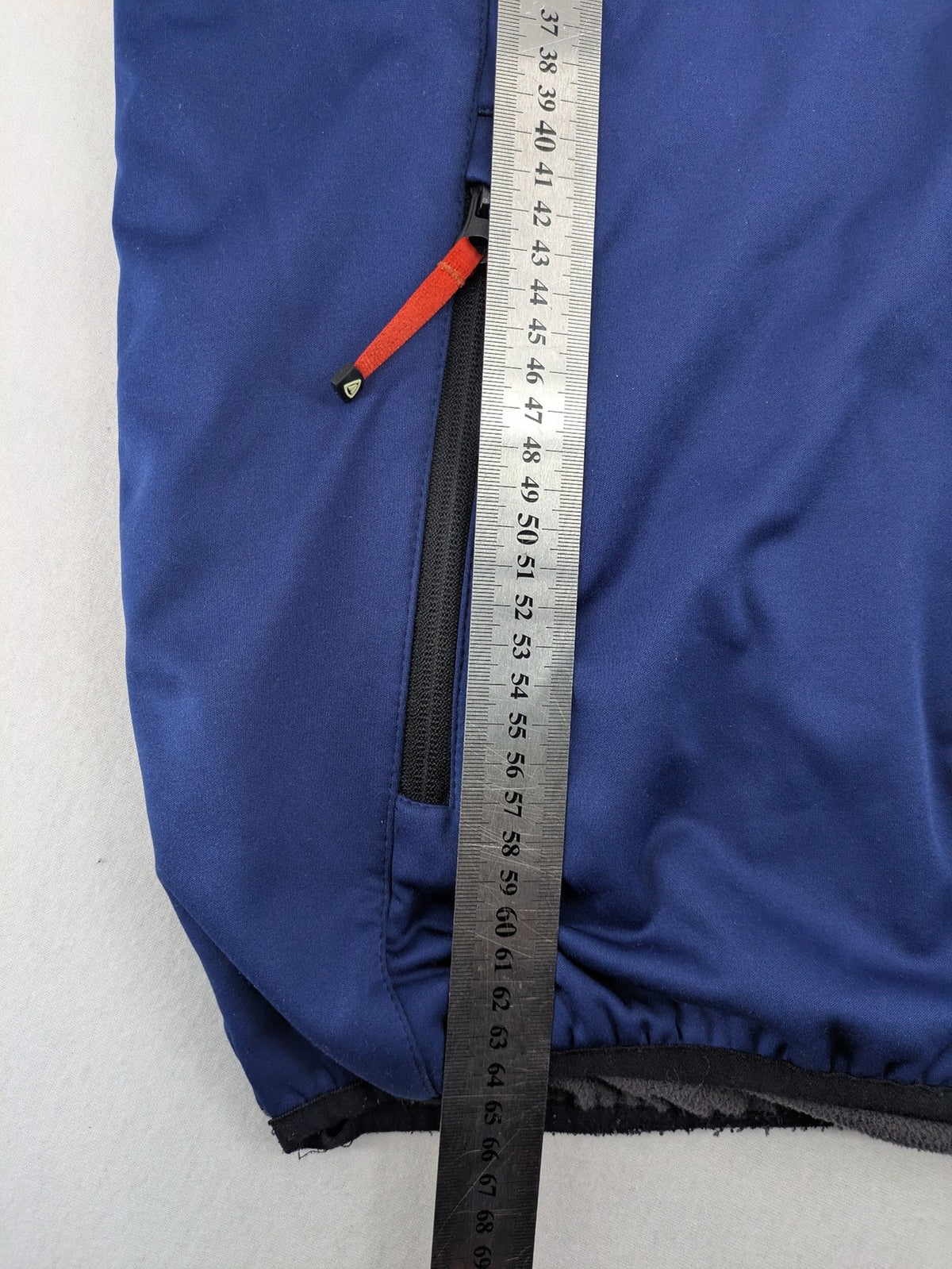 Firefly blue softshell jacket with adjustable hood and prominent chest logo.