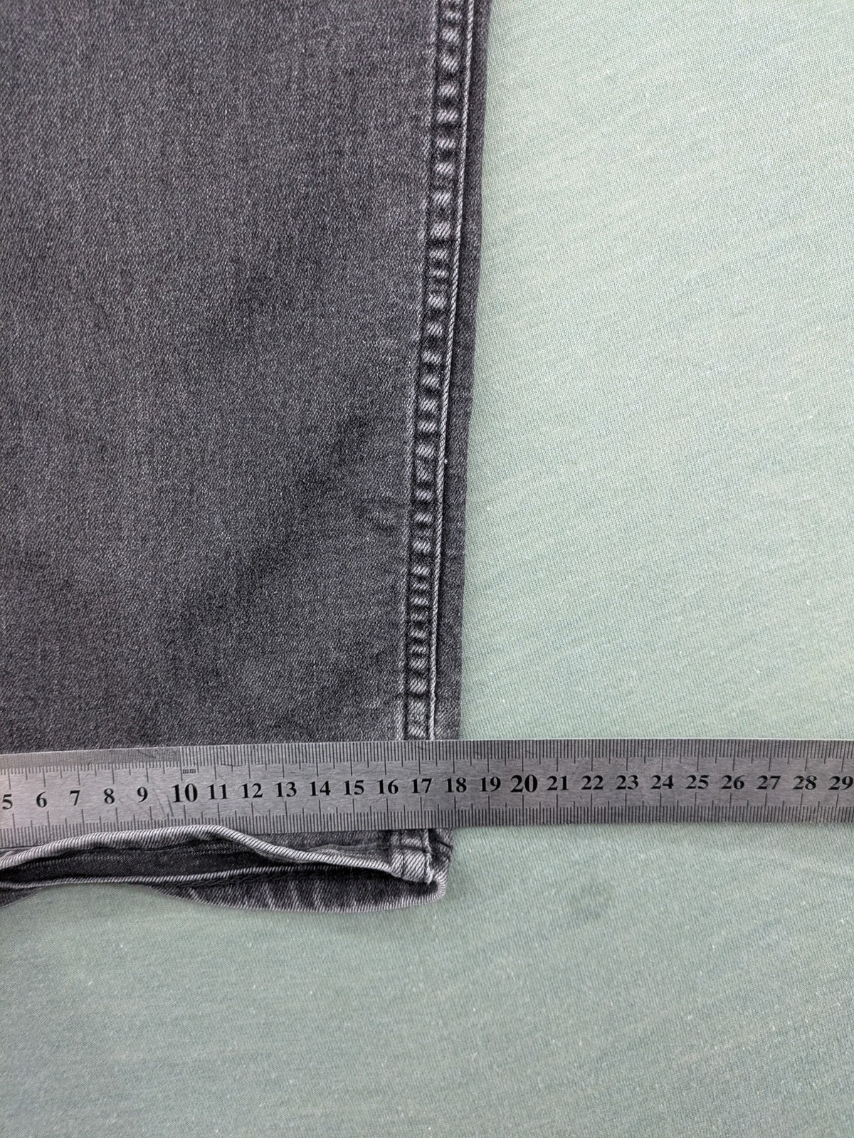 H&M grey slim fit jeans with adjustable waistband and faded wash detail.