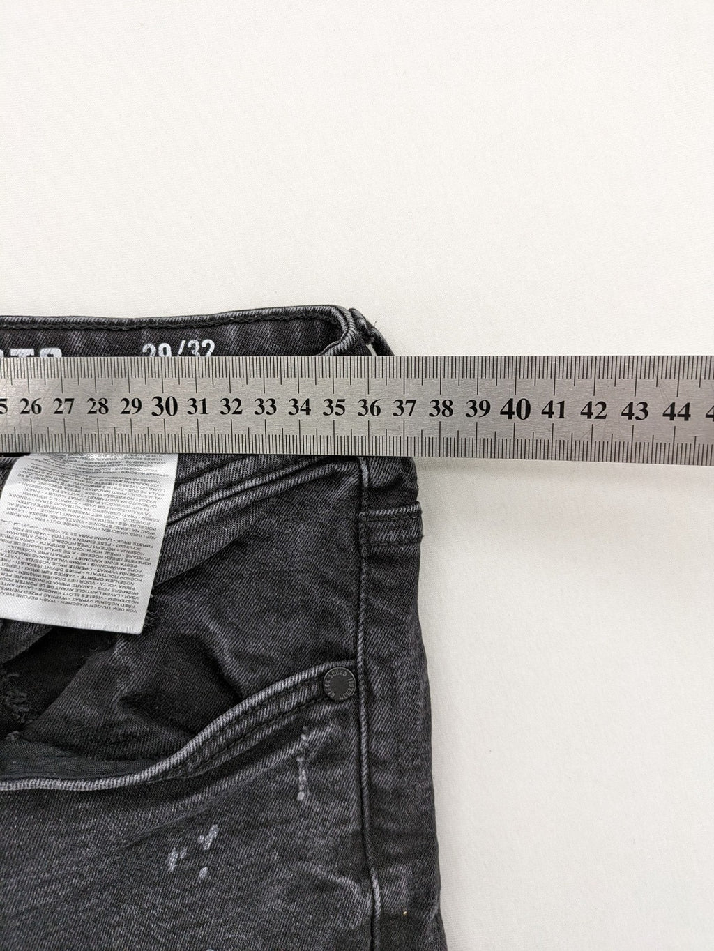 Black Squad skinny fit jeans black distressed ripped design with subtle paint splatter.