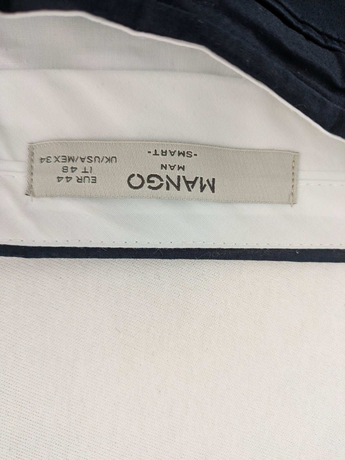 Mango Man black chinos flat front design with zipper and button closure.