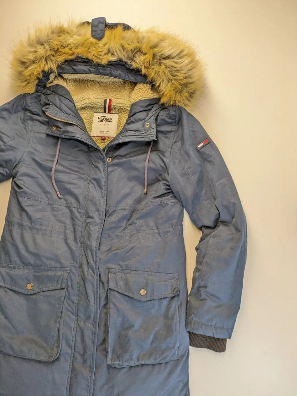 Tommy Hilfiger Denim blue parka coat with faux fur hood and Sherpa lining.