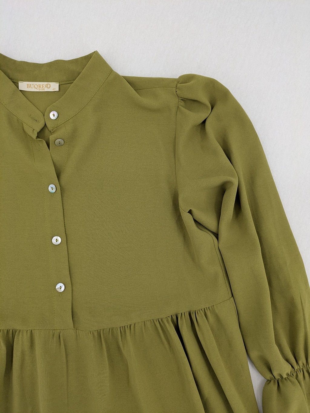 Buqre Store khaki A-line dress with puff sleeves, ruffled cuffs, and button placket.