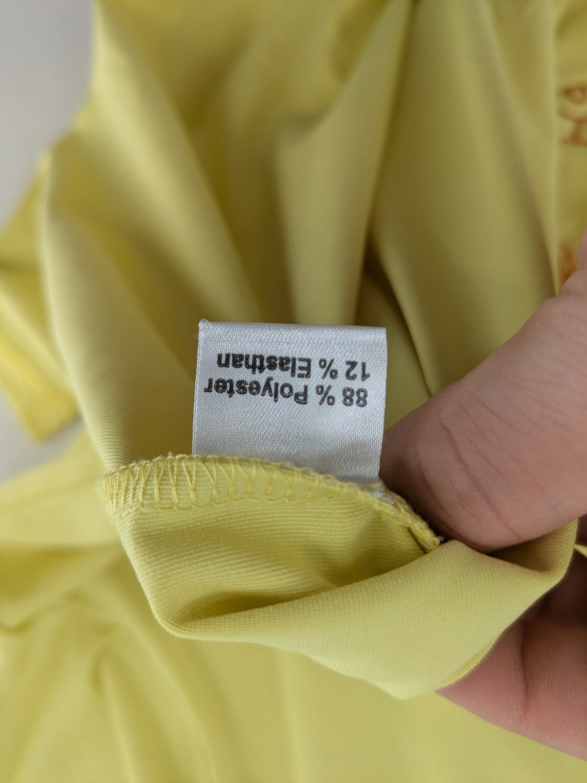 in-Spots yellow t-shirt with butterfly glitter graphic and textured bead details