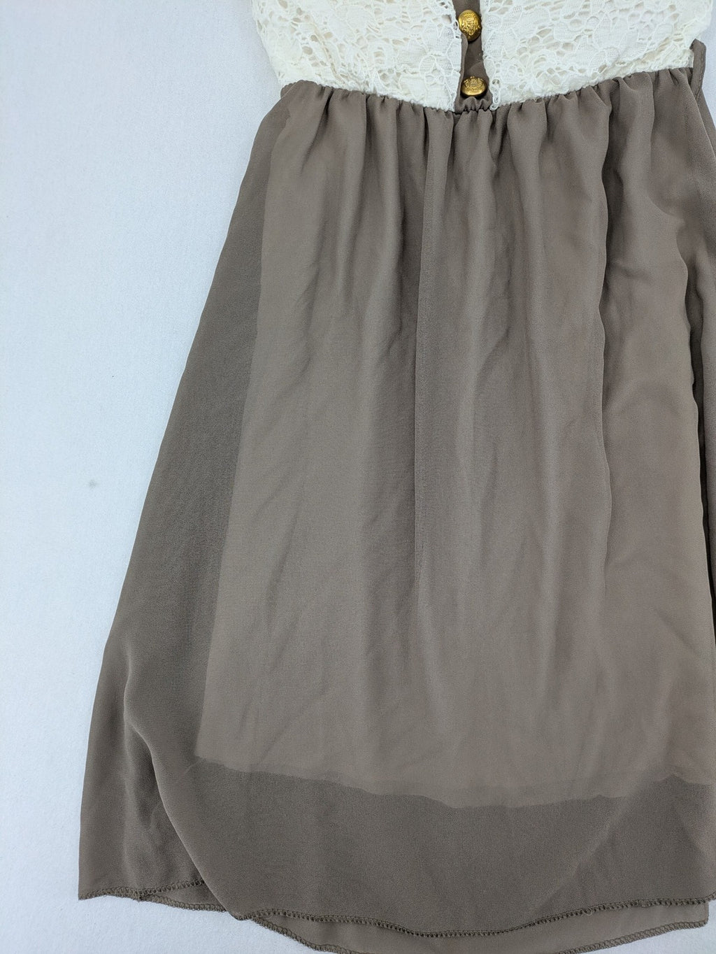 Creme bandeau summer dress in taupe with lace top and decorative gold buttons.