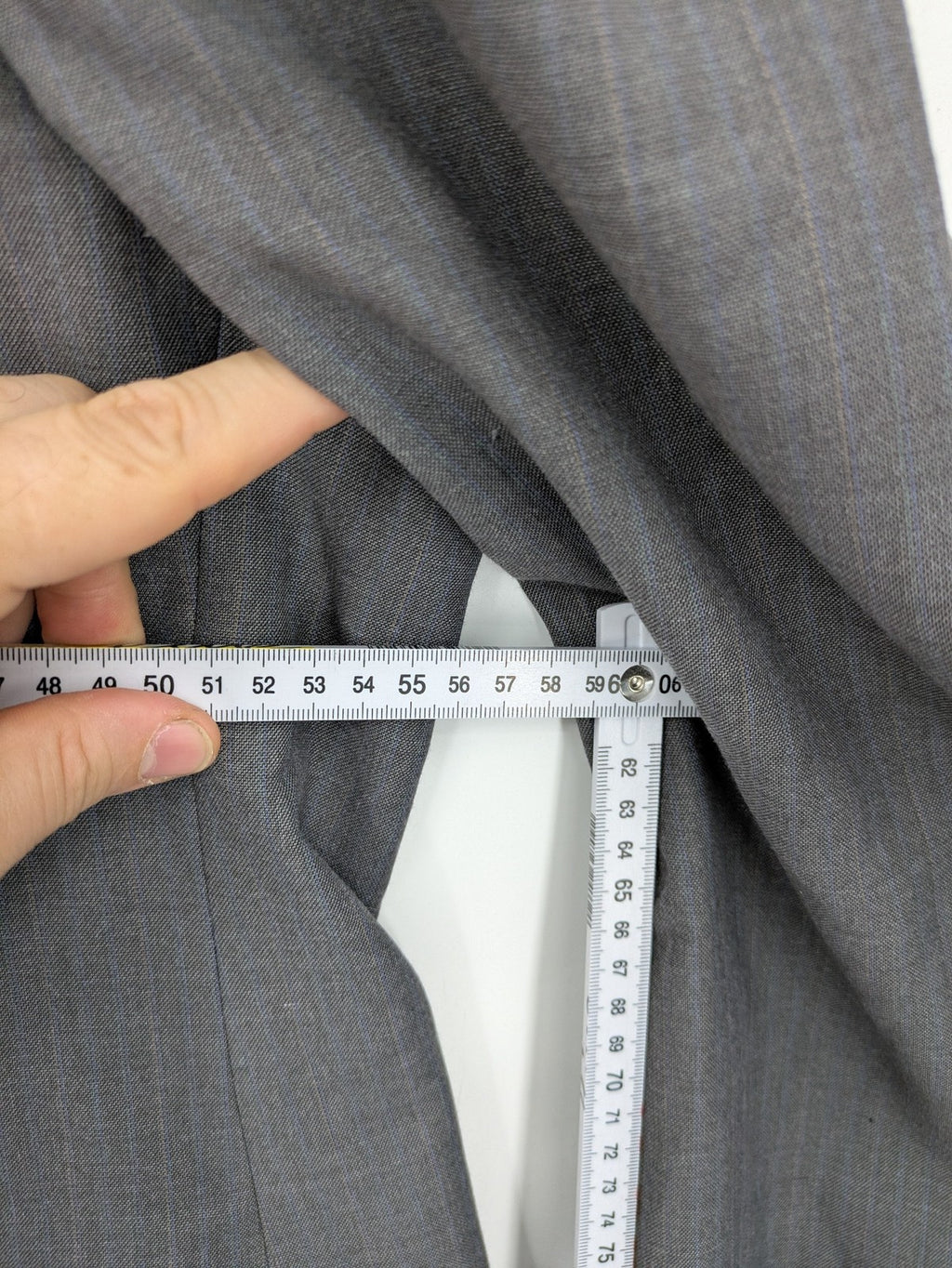Alextrading grey jacket with subtle light blue pinstripe pattern and notch lapels.