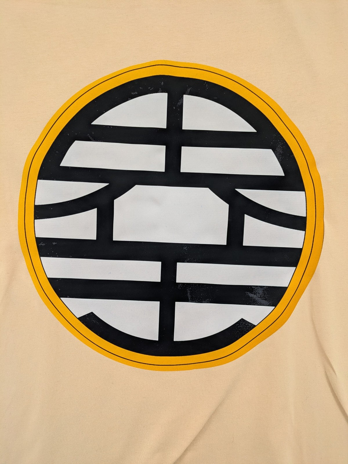 Dragon Ball Z beige t-shirt relaxed fit featuring Goku Go kanji symbol.