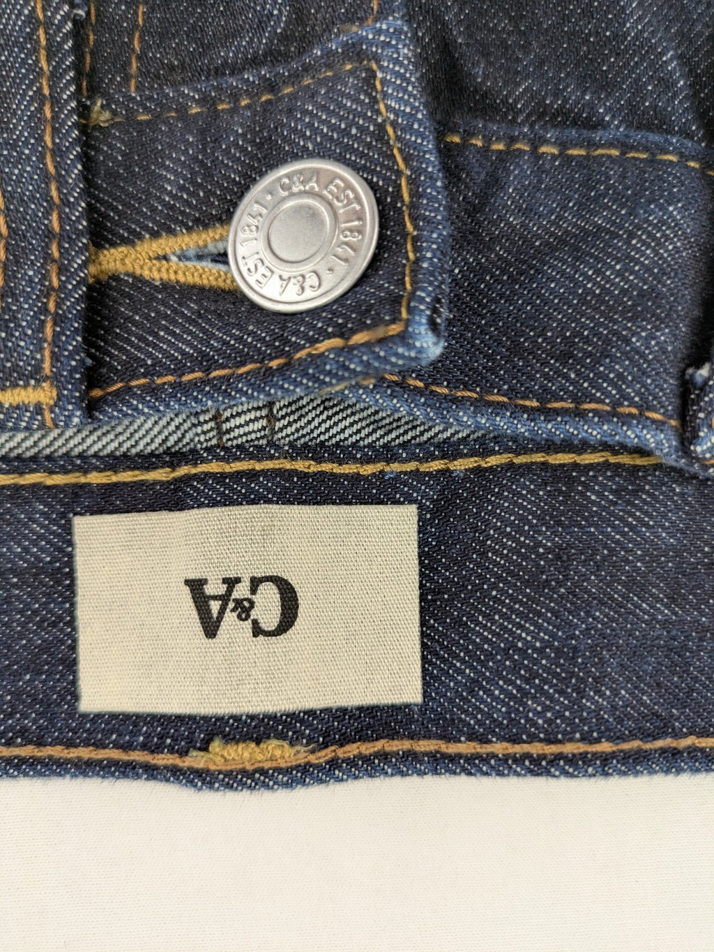 C&A blue straight jeans W28 L32 with 5-pocket design and contrasting orange stitching.