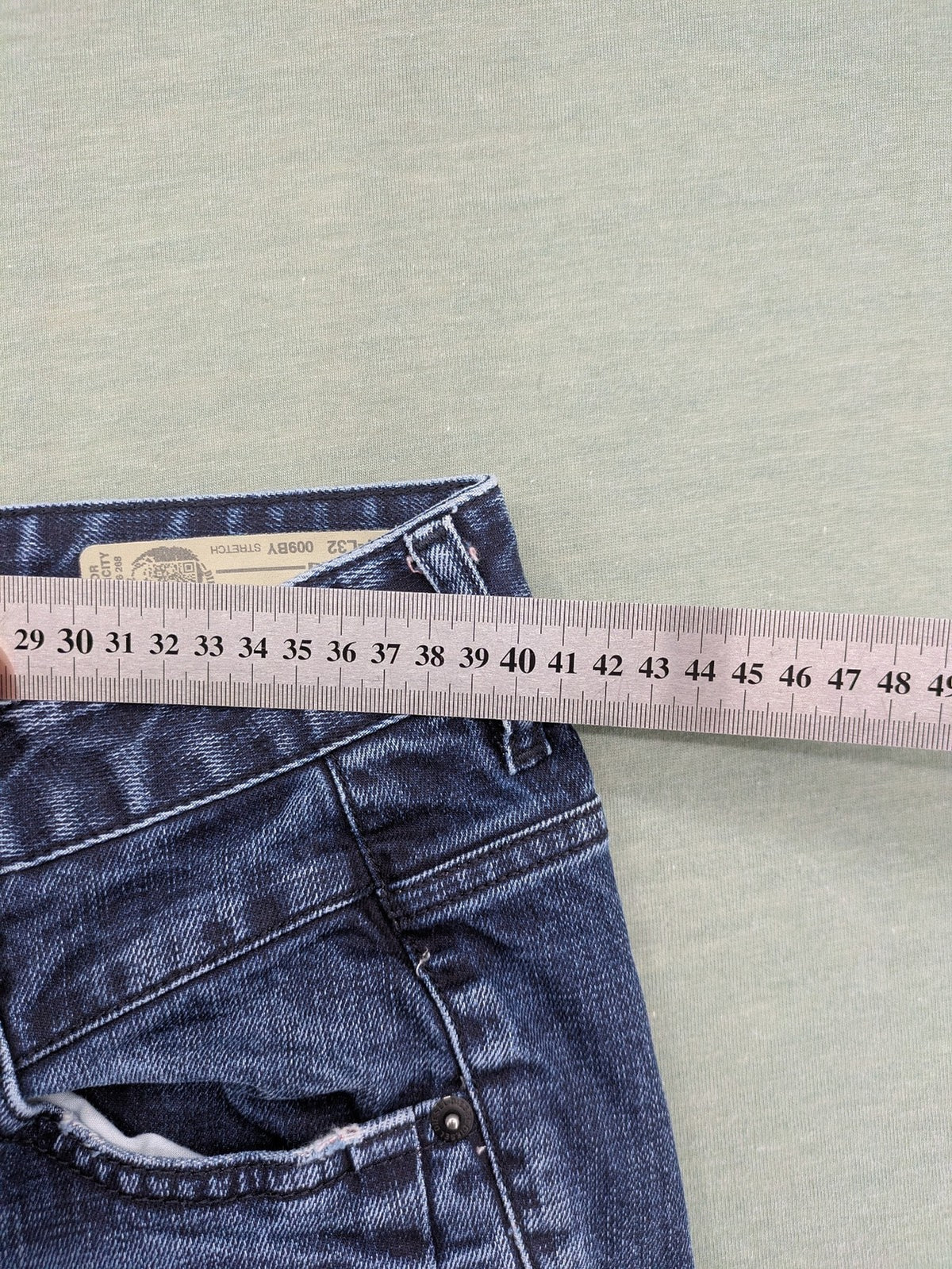 Diesel blue boyfriend jeans low waist dark wash stretch denim with logo patch.