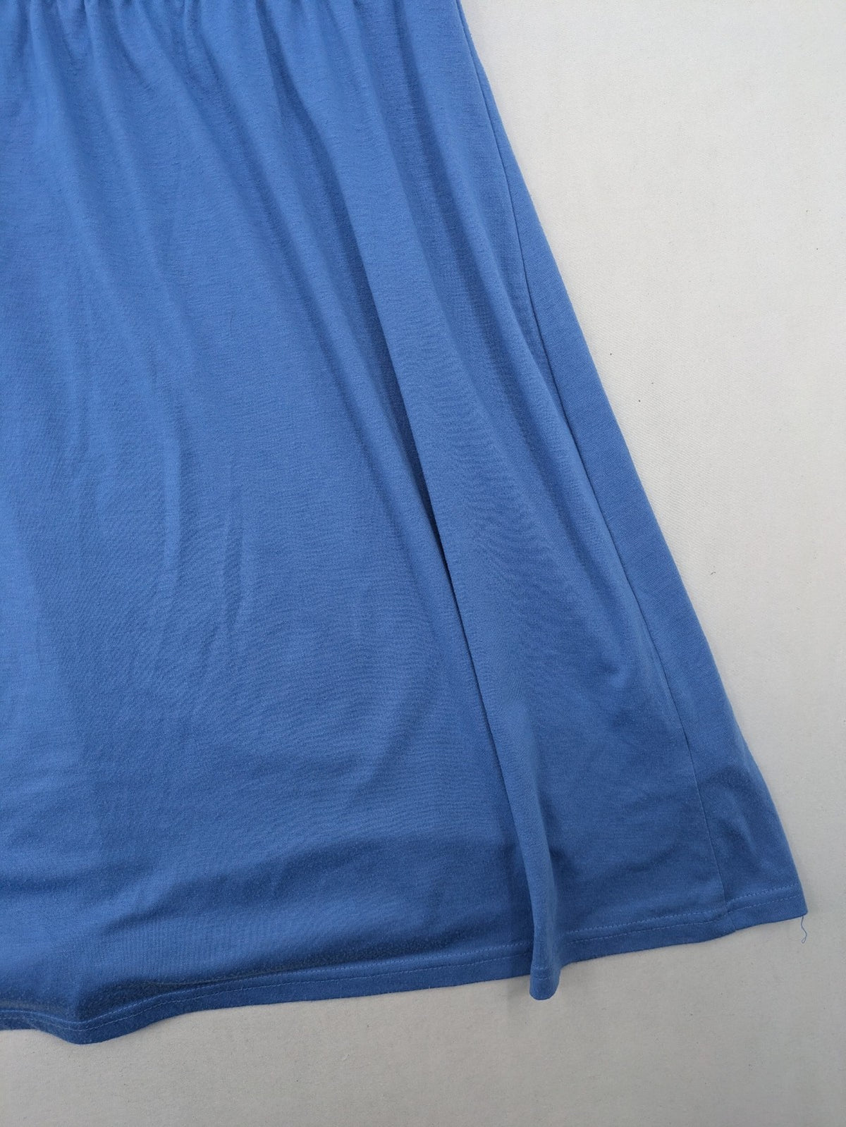 Infinity blue T-shirt dress A-line cut with playful flutter sleeves and soft stretch fabric.