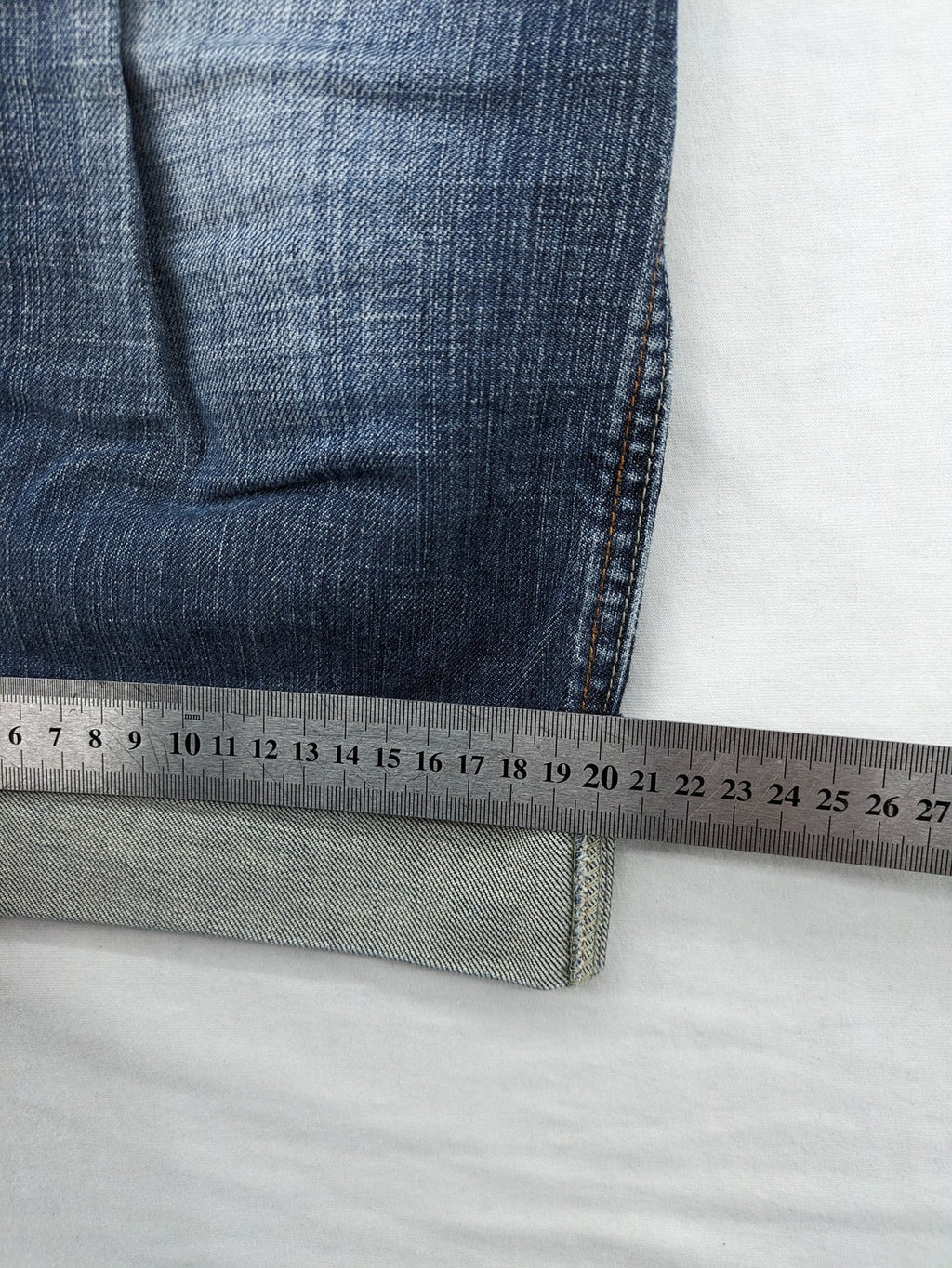 BLU blue straight jeans with washed effect, rolled hem, and five-pocket design.
