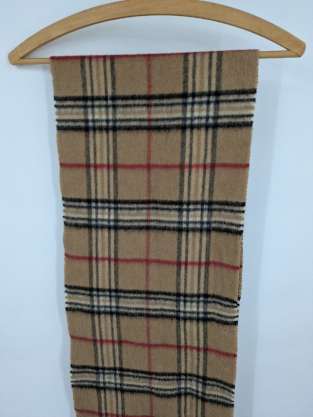 Karo unisex scarf camel brown tartan pattern 100% cashmere with black, white, and red accents.