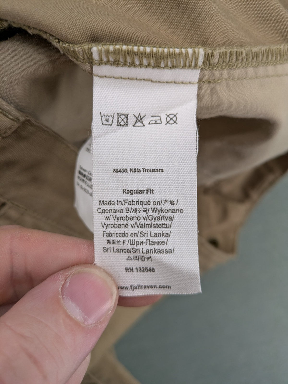 Fjällräven beige pants regular fit durable fabric outdoor style with logo detail.