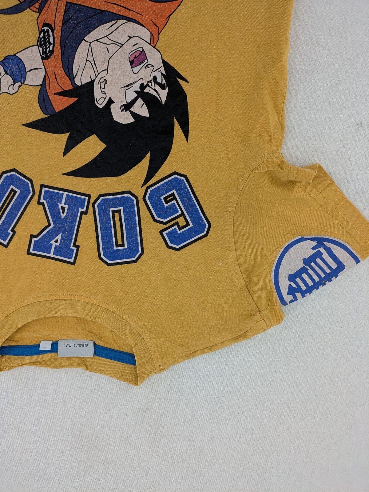 Dragon Ball Z button-down shirt multi with large Son Goku action print.