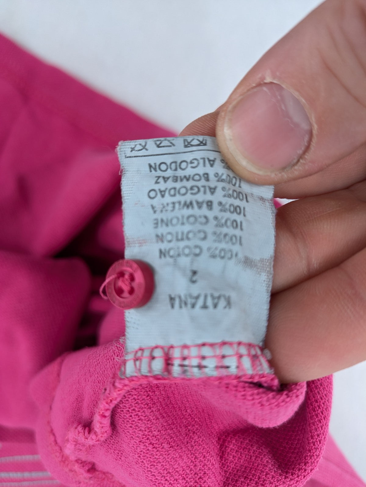 Geographical Norway pink polo shirt with embroidered Saint Malo design and Gingham trim.