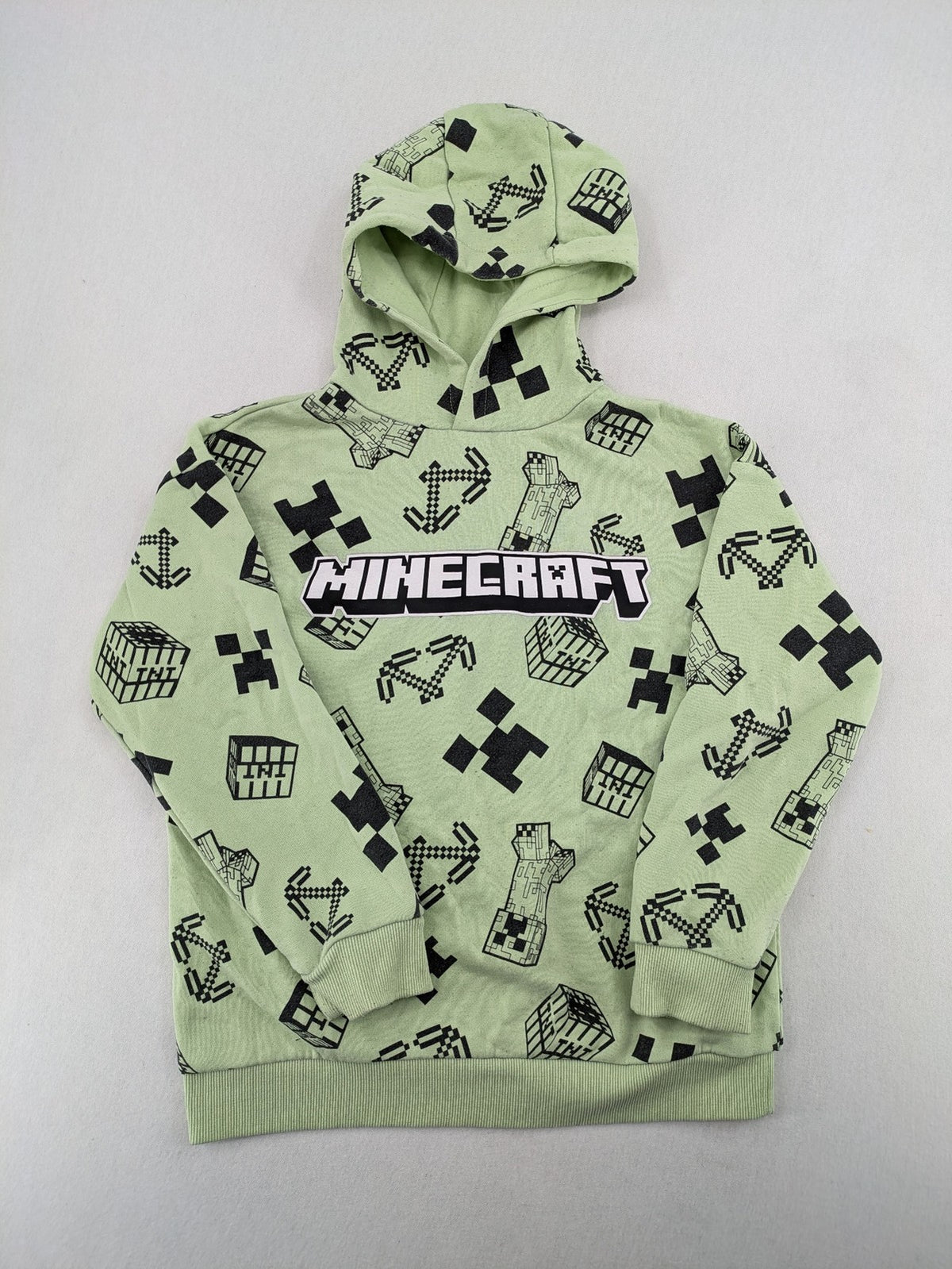 Minecraft zip-through hoodie green all-over print with Creeper and logo details.