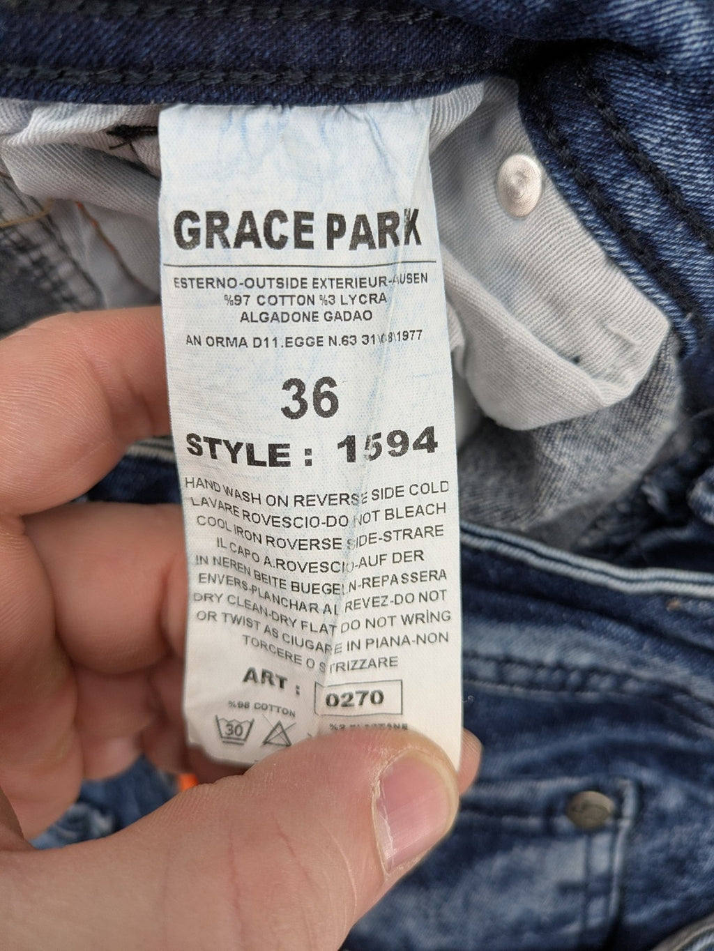Stark straight jeans multi distressed acid wash with orange patches and side stripes.
