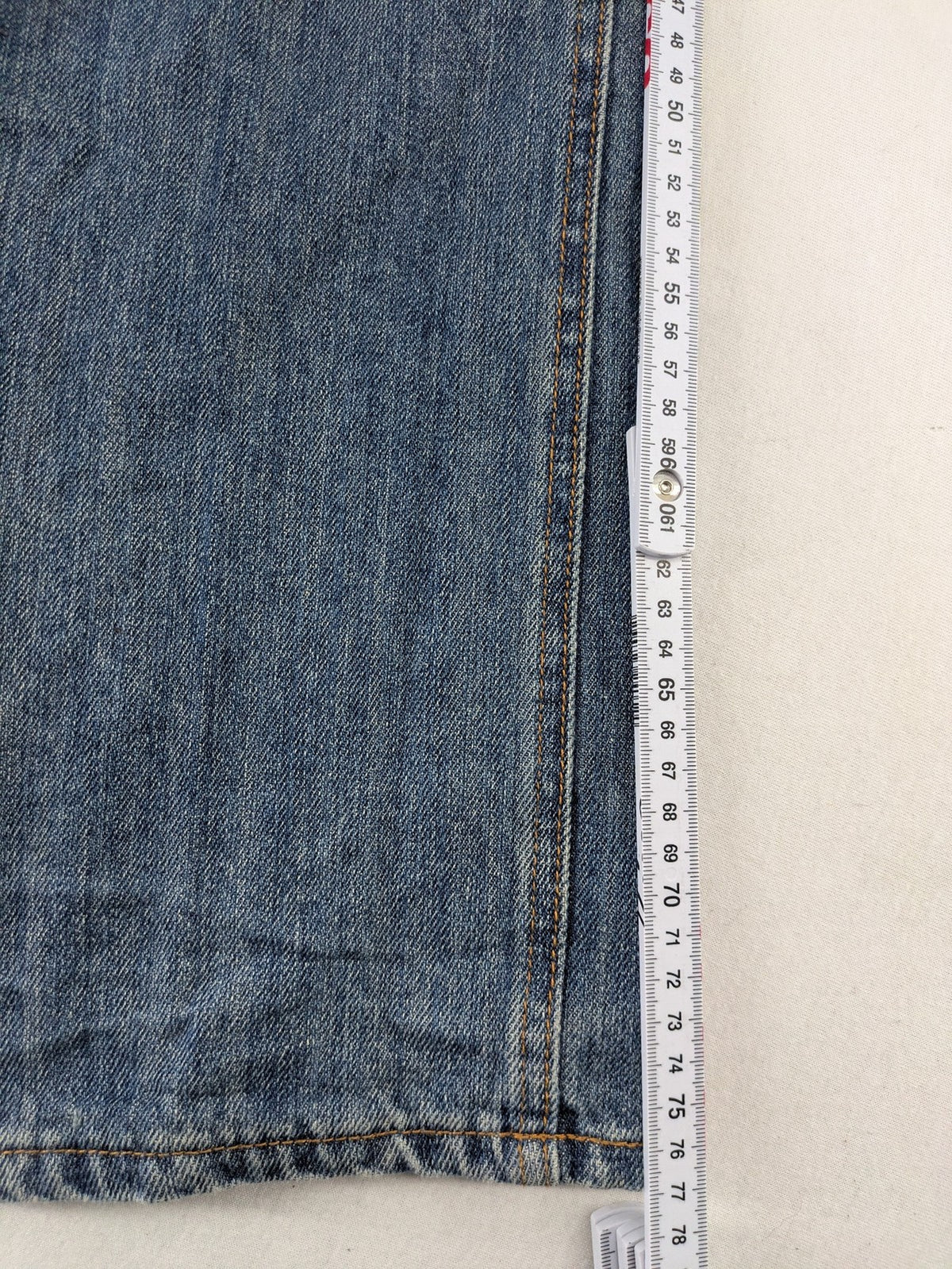Cheap Monday blue straight jeans with button fly and classic medium wash finish.