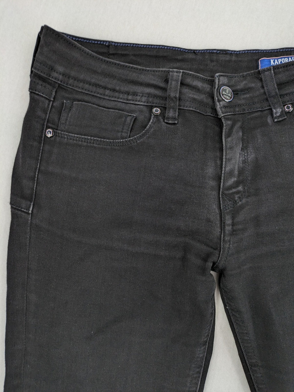 Kaporal black slim fit jeans with classic 5-pocket design and stretch denim material.