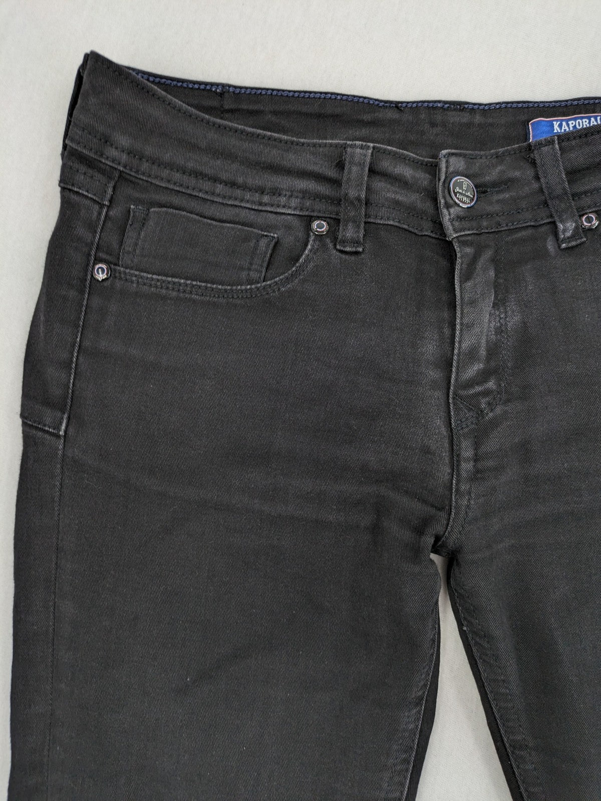 Kaporal black slim fit jeans with classic 5-pocket design and stretch denim material.