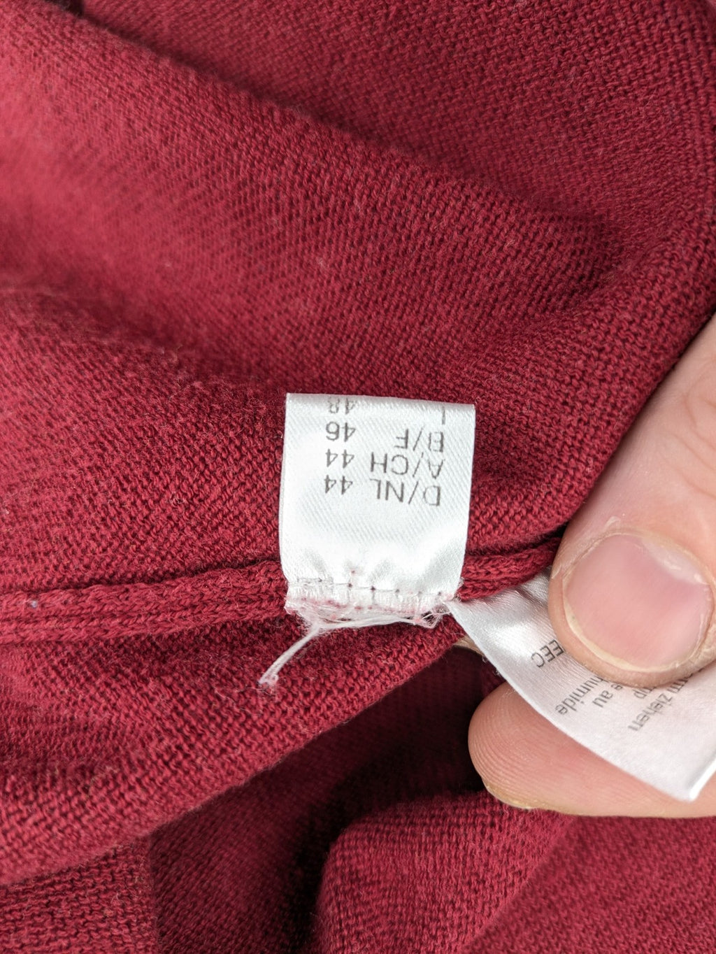Les Corps burgundy turtle neck jumper with ribbed details and soft cotton blend material.