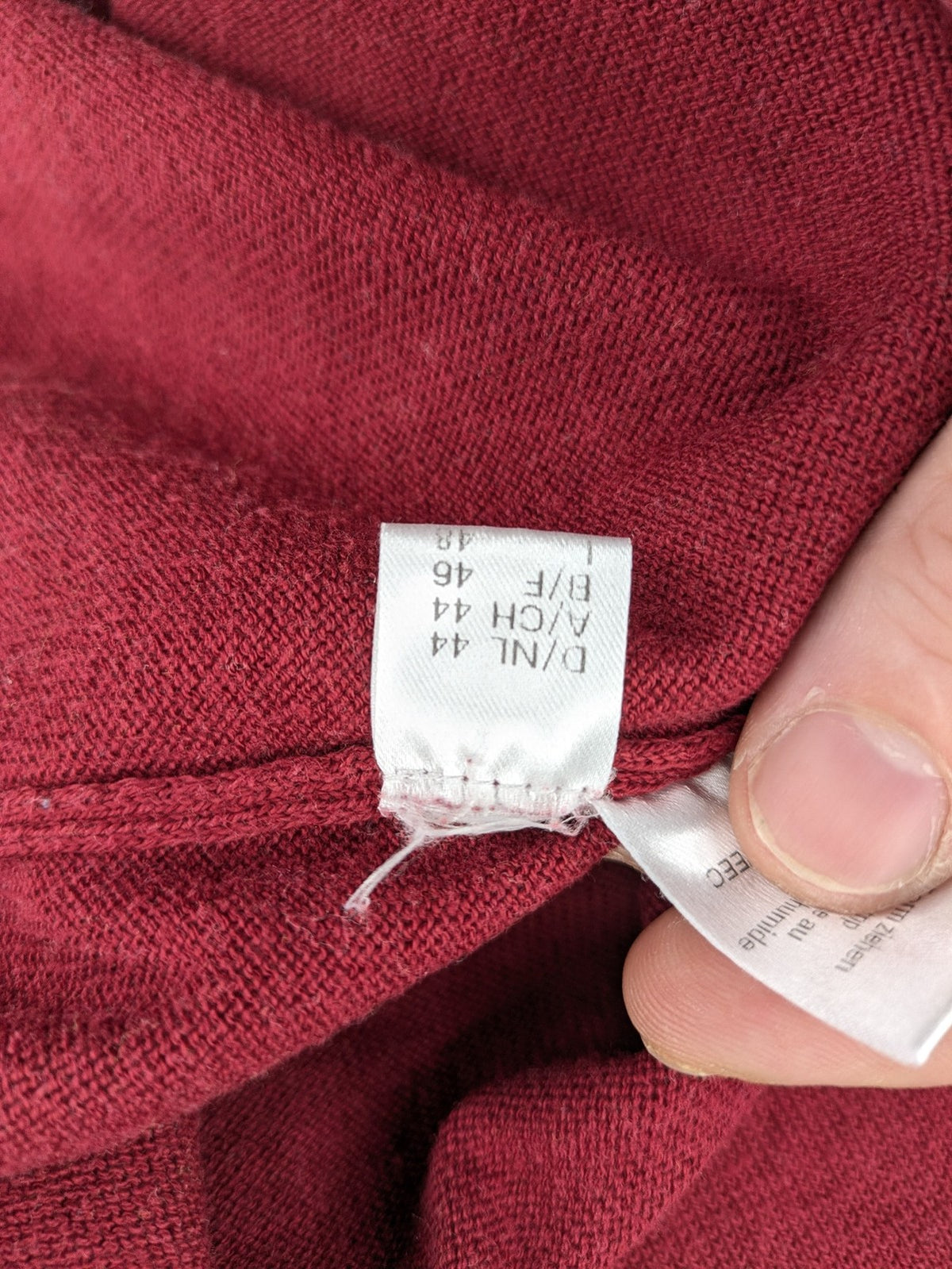 Les Corps burgundy turtle neck jumper with ribbed details and soft cotton blend material.