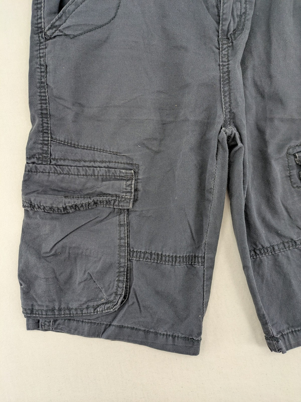 Crosswind grey cargo shorts with multiple pockets and durable cotton material.
