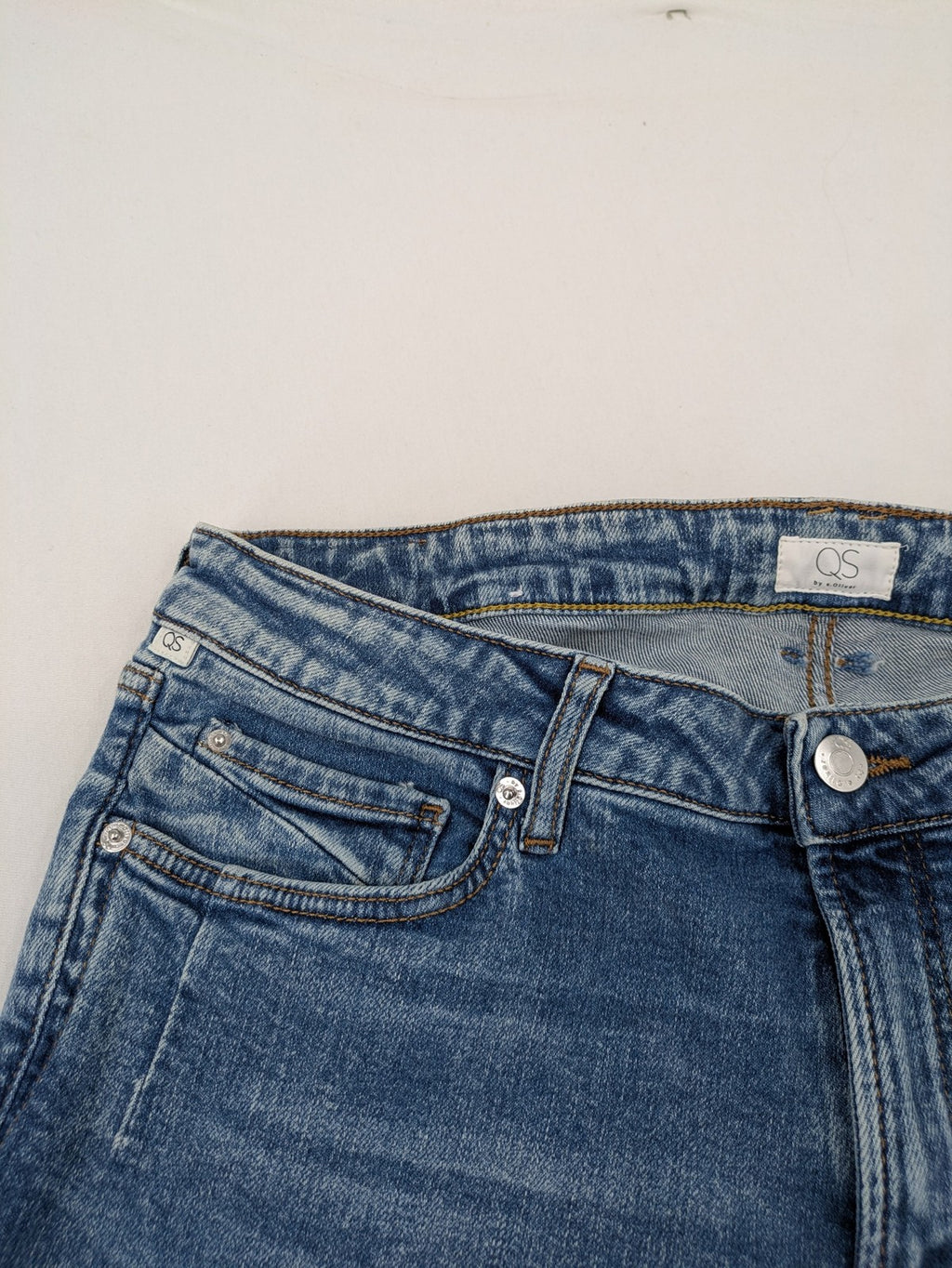 QS by s.Oliver green bootcut jeans with ankle zippers and classic denim wash.