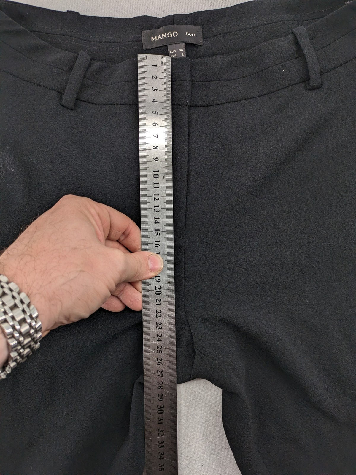Mango Suit black trousers with zipper, belt loops, and front slant pockets.