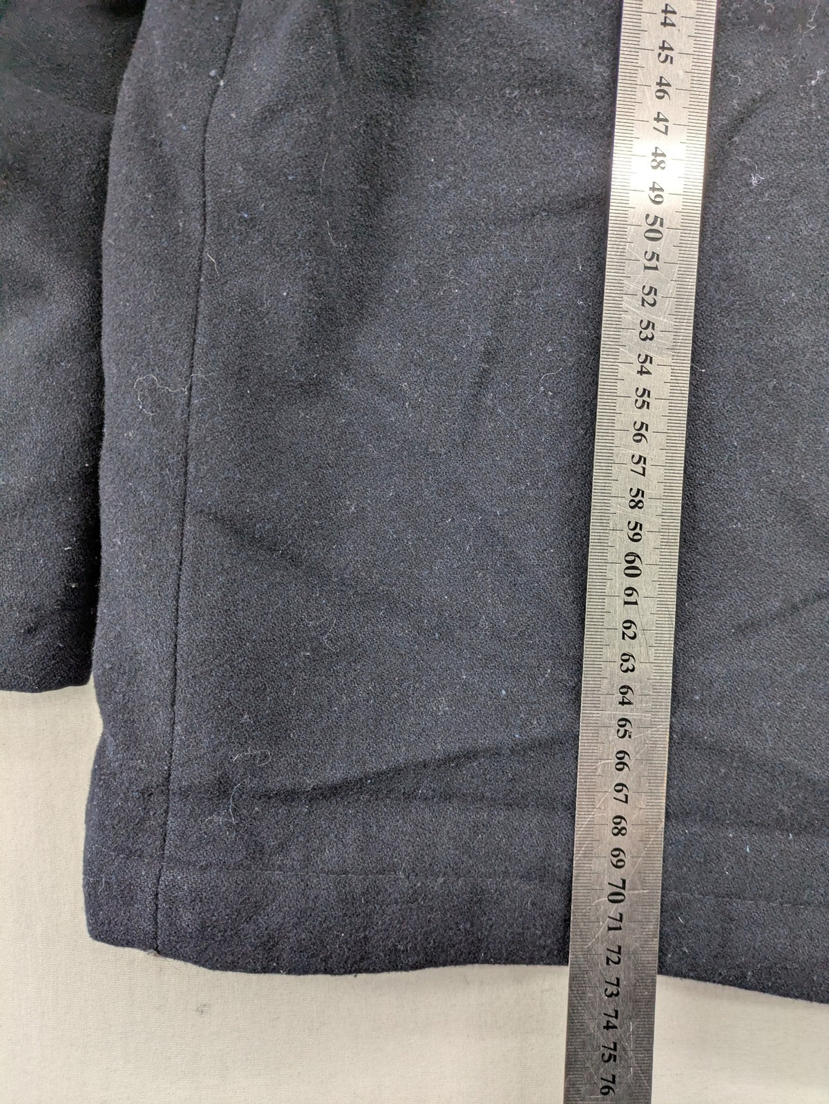 Angelo Litrico black duffle coat with toggle closure and cream Sherpa-lined hood.