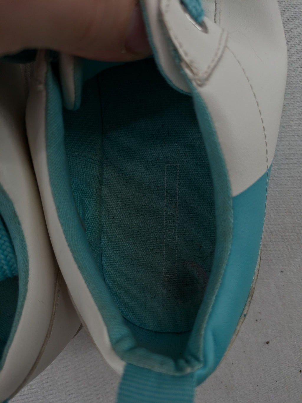 Esprit women's sneakers white with turquoise accents and wide laces.