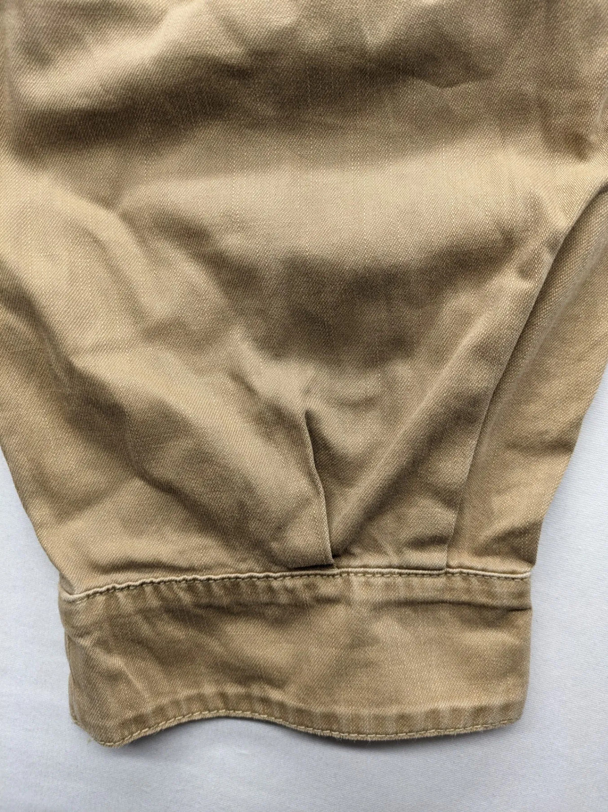 H&M beige tapered leg pants with pleats, high waist, 100% cotton, side pockets.