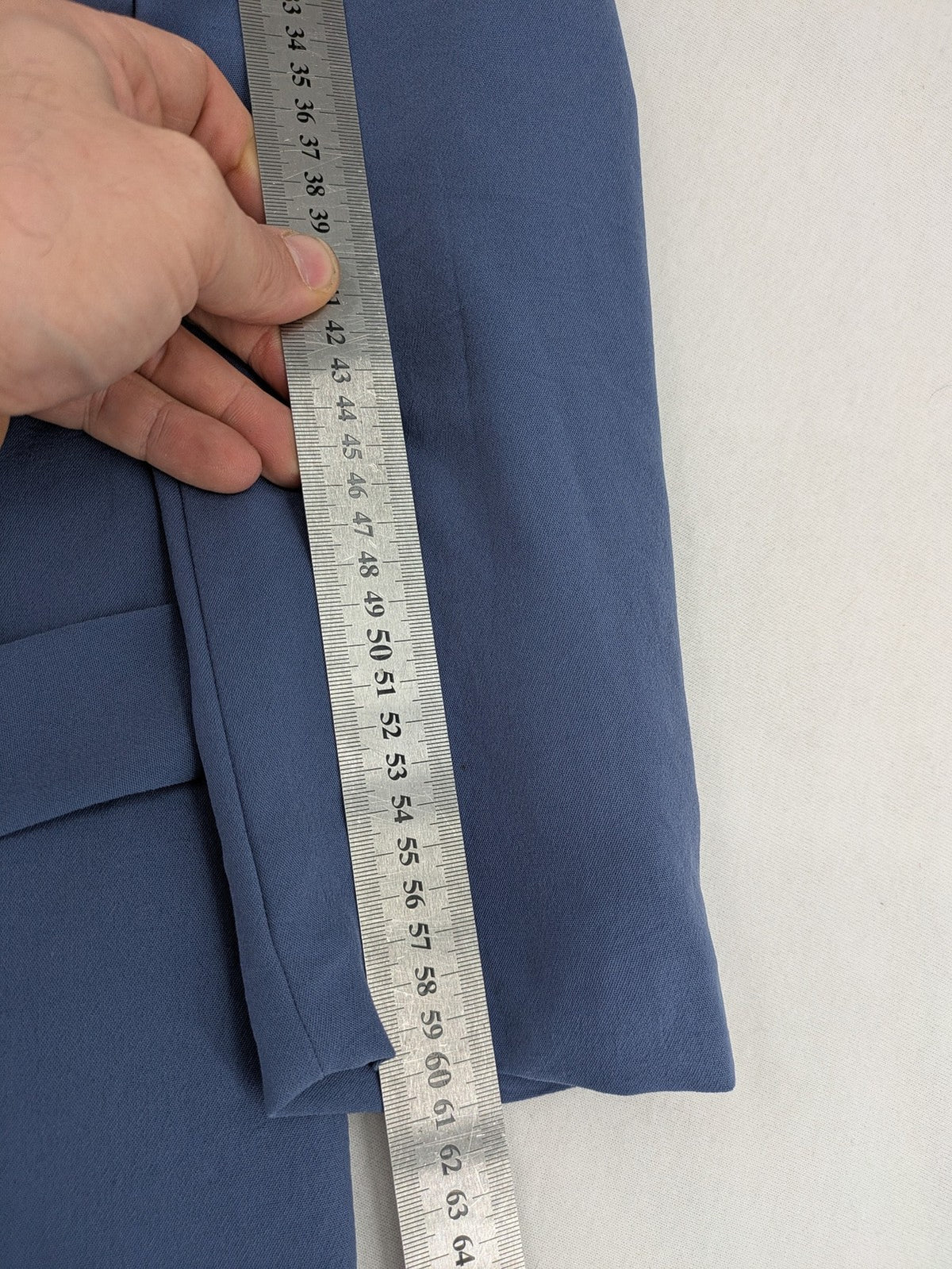 DeFacto blue trench coat with classic lapels and matching self-tie belt.