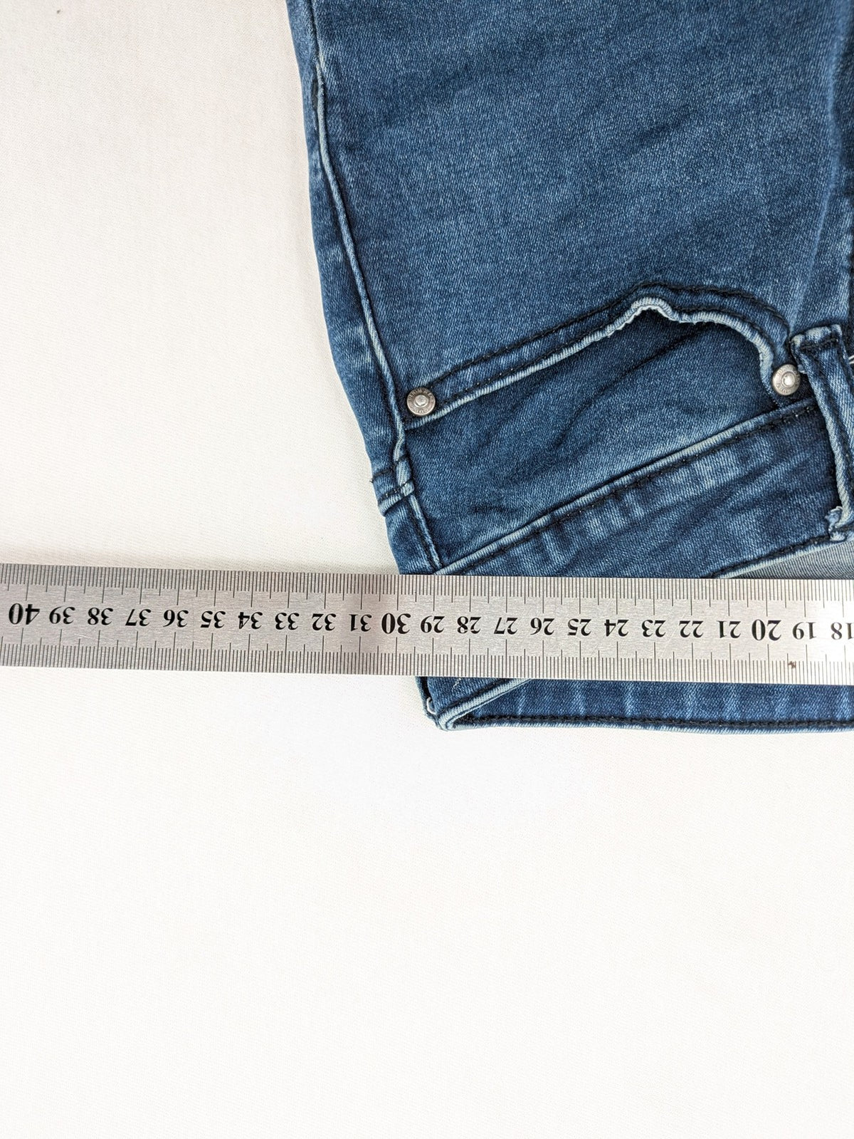 Dust blue skinny jeans with mid-rise waist and classic wash, stretch denim material.