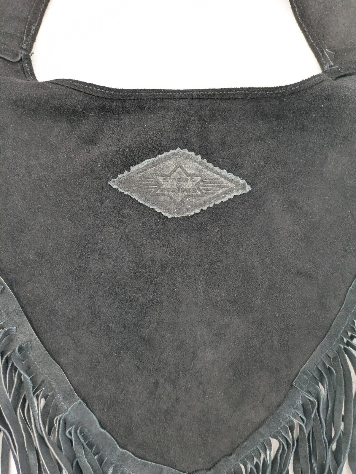 Stars & Stripes black suede fringe vest with silver conchos and beaded tassels.