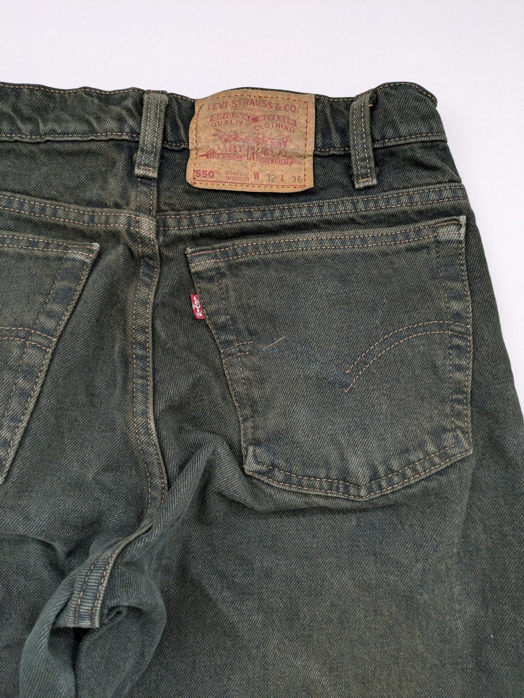Levi's green 550 relaxed fit tapered jeans, vintage denim, made in USA.
